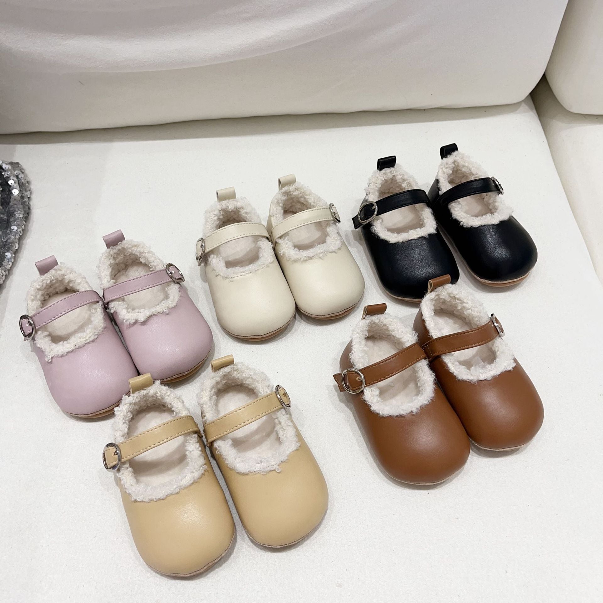 Infant baby girl plush warm anti-slip shoes in various colors including black, purple, yellow, beige, and brown, perfect for winter.