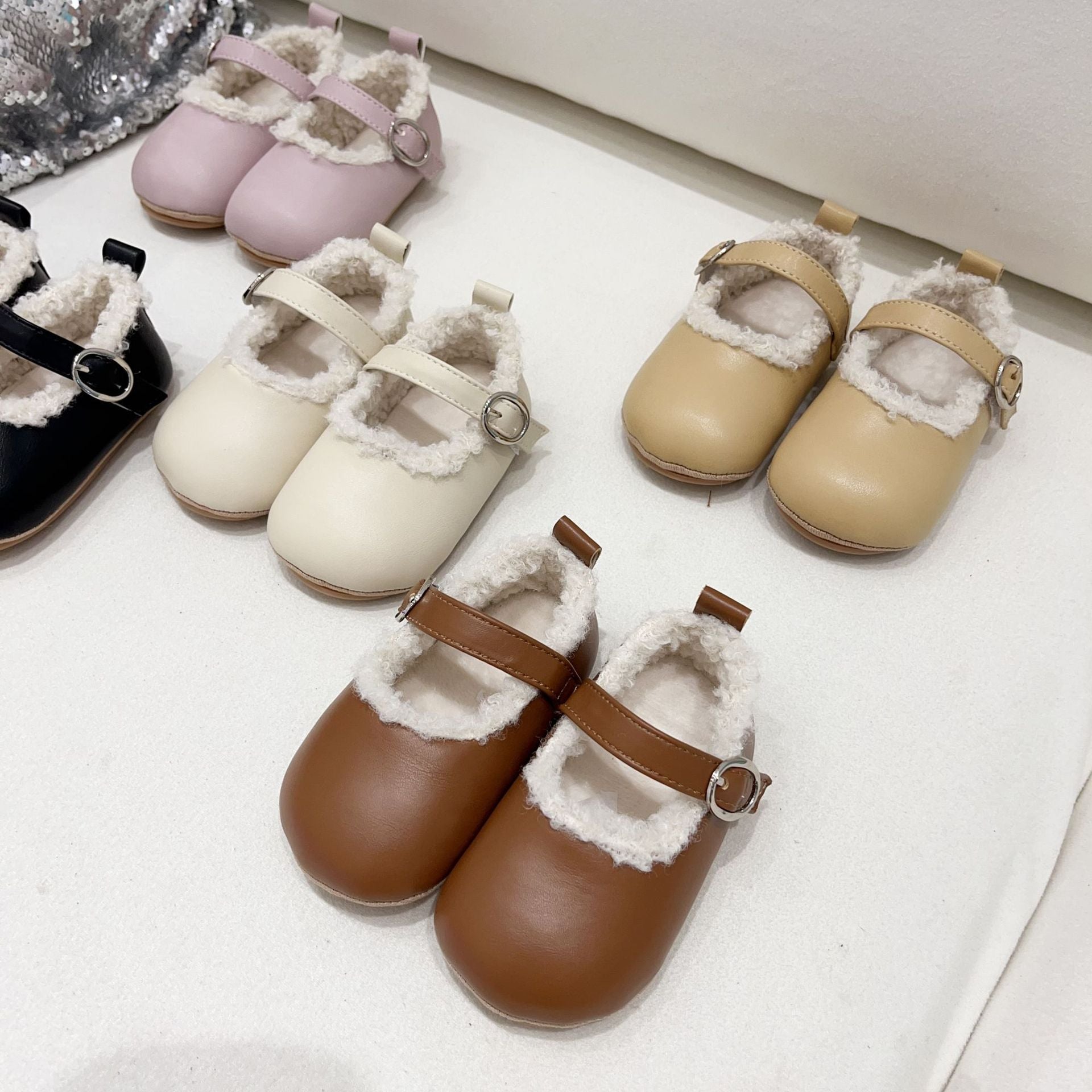 Infant baby girl plush warm anti-slip shoes in various colors including black, purple, yellow, beige, and brown, perfect for winter.