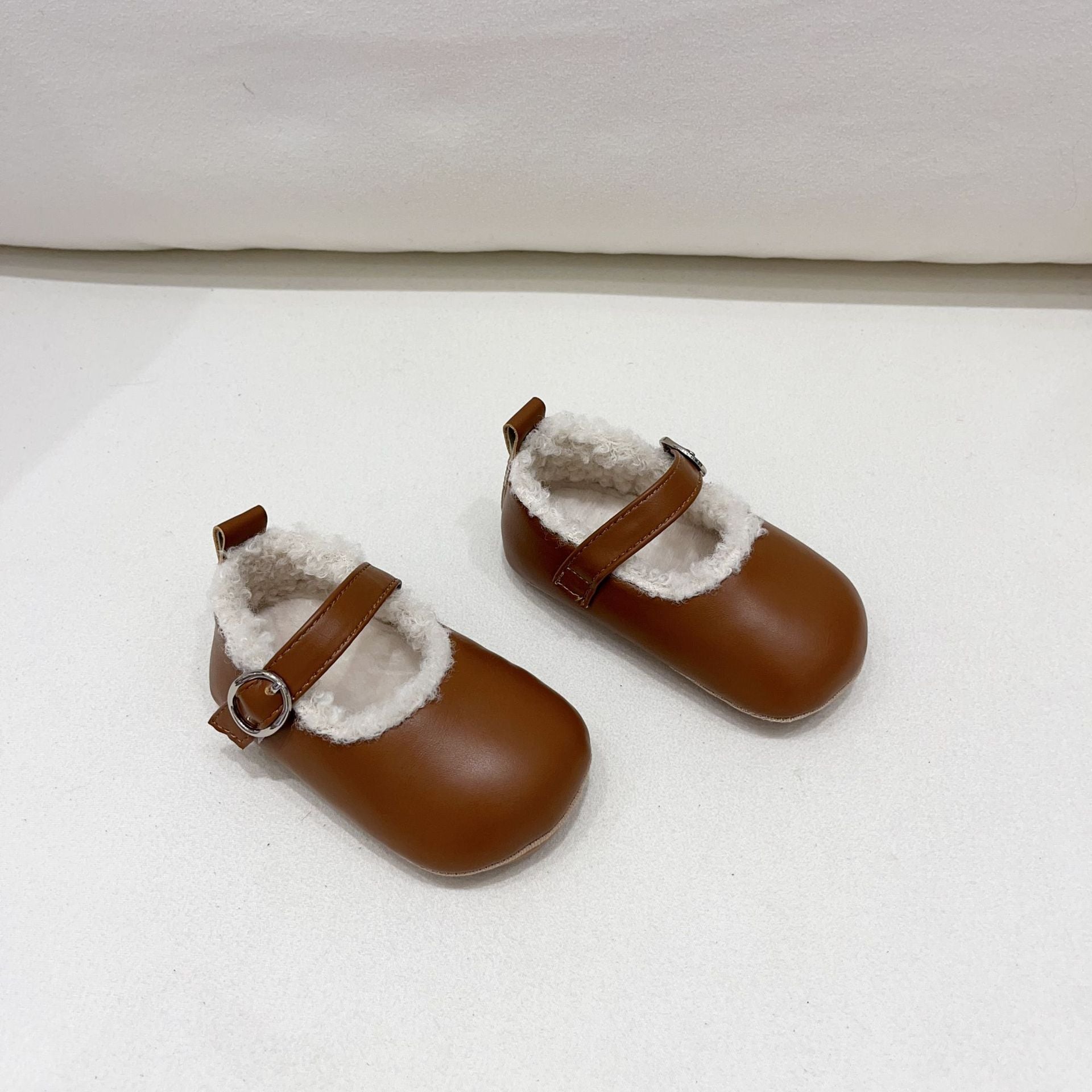 Infant baby girl plush warm anti-slip shoes in various colors including black, purple, yellow, beige, and brown, perfect for winter.