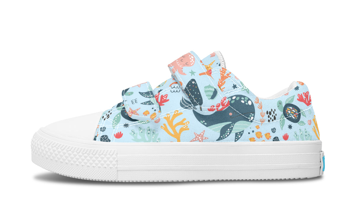 Colorful kids low top shoes featuring various sea animals, perfect for playful adventures.