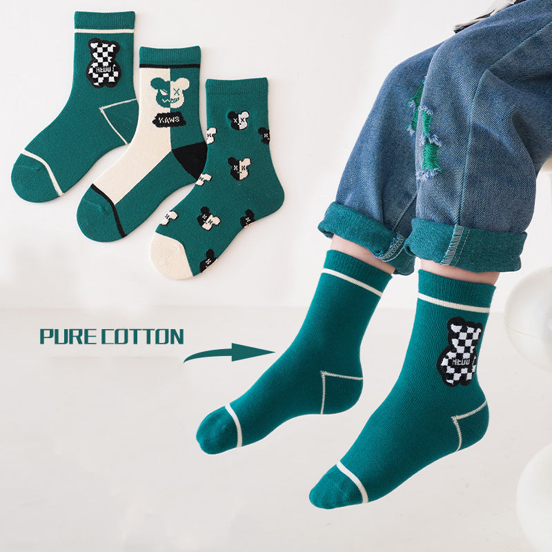 A colorful set of kids unisex crew socks featuring embroidery patterns, available in various colors and fun designs.