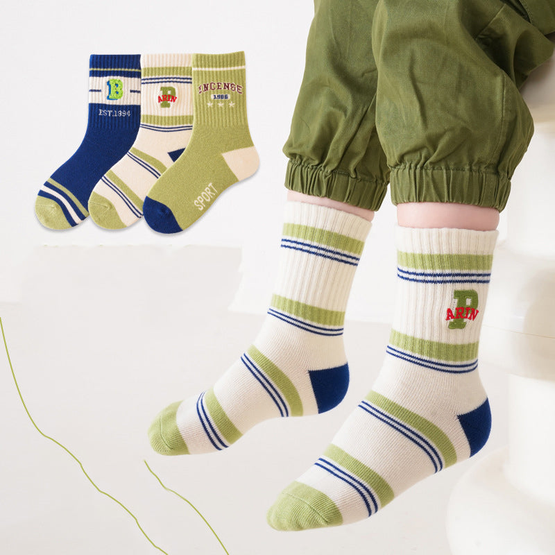 A colorful set of kids unisex crew socks featuring embroidery patterns, available in various colors and fun designs.
