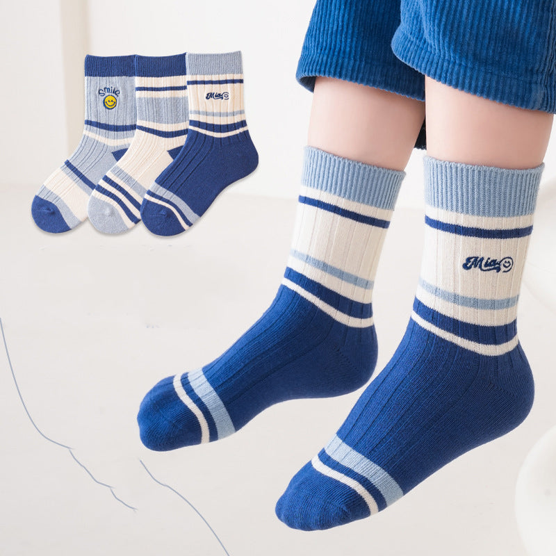 A colorful set of kids unisex crew socks featuring embroidery patterns, available in various colors and fun designs.