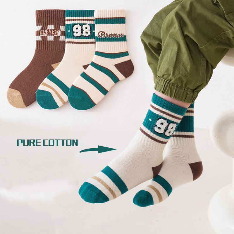 A colorful set of kids unisex crew socks featuring embroidery patterns, available in various colors and fun designs.