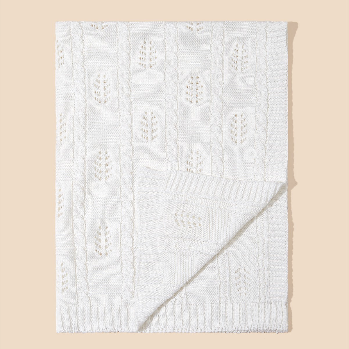 Knitted baby blanket featuring a hollow-out design in solid colors, perfect for all seasons.