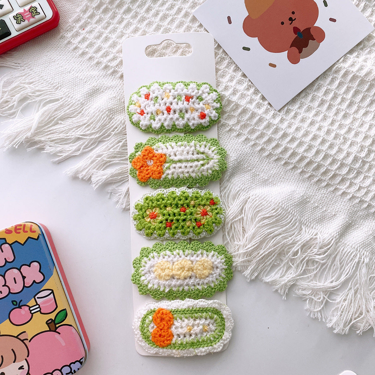 Korean-style versatile knit hair clip featuring a sweet floral design in vibrant colors, suitable for baby girls and girls aged 0-12 years.