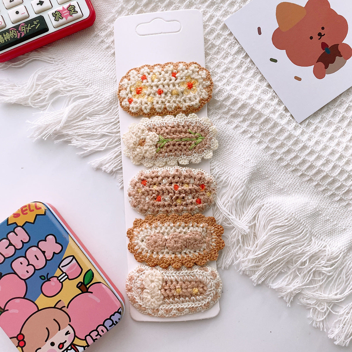 Korean-style versatile knit hair clip featuring a sweet floral design in vibrant colors, suitable for baby girls and girls aged 0-12 years.
