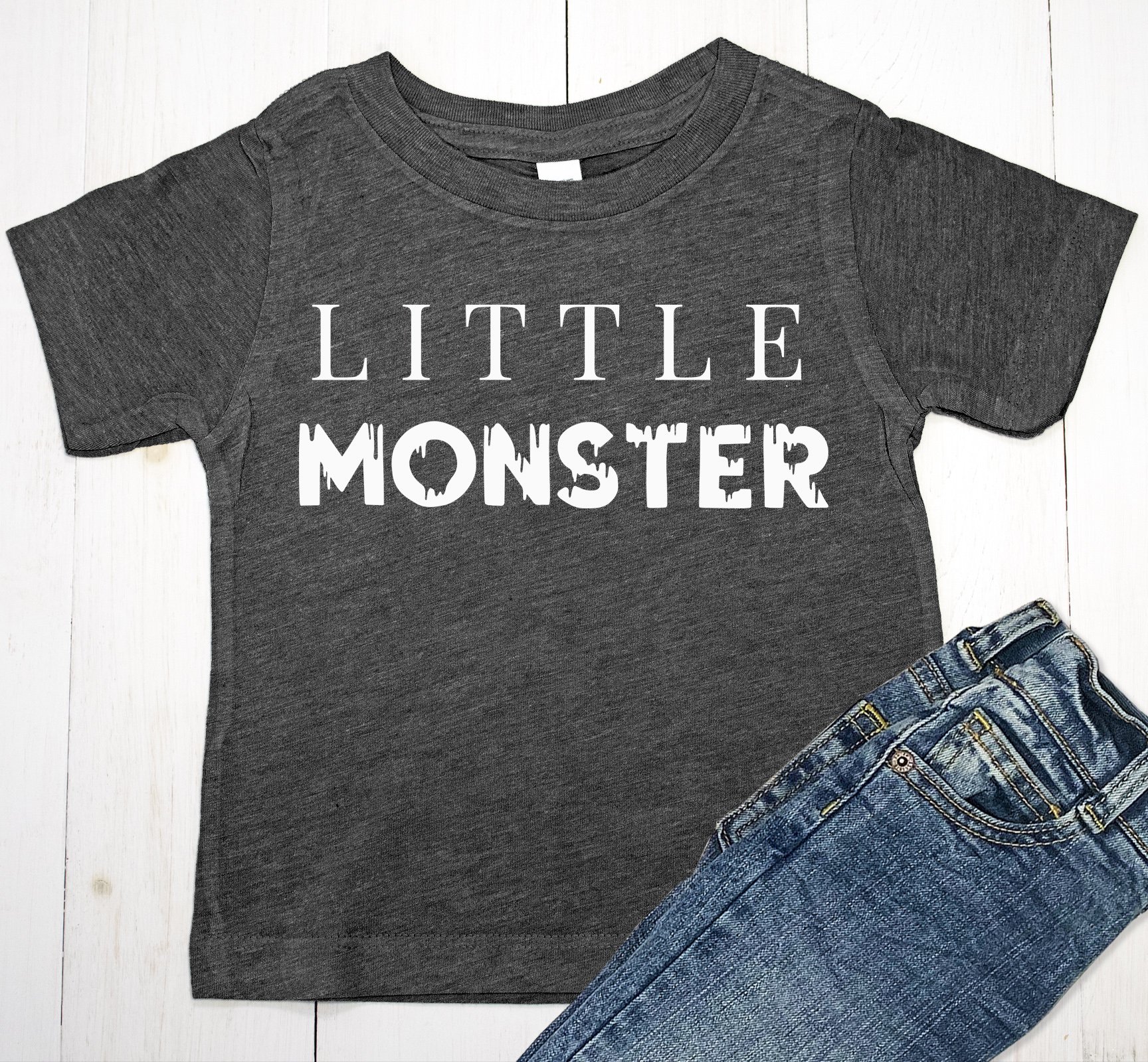 Little Monster Halloween shirt for baby boys and toddlers in olive and black colors, featuring a playful design.