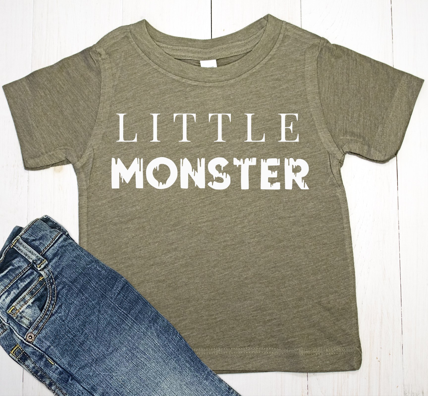Little Monster Halloween shirt for baby boys and toddlers in olive and black colors, featuring a playful design.