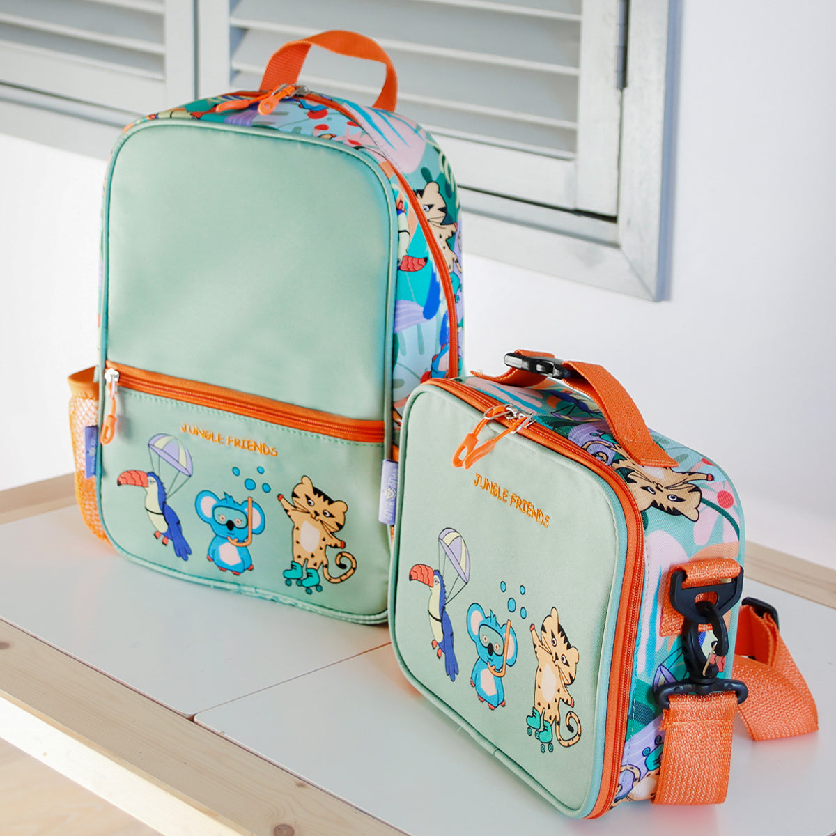 Milk&Moo Jungle Collection Rucksack and Lunchbox Set featuring vibrant jungle designs, adjustable straps, and insulated lunchbox.