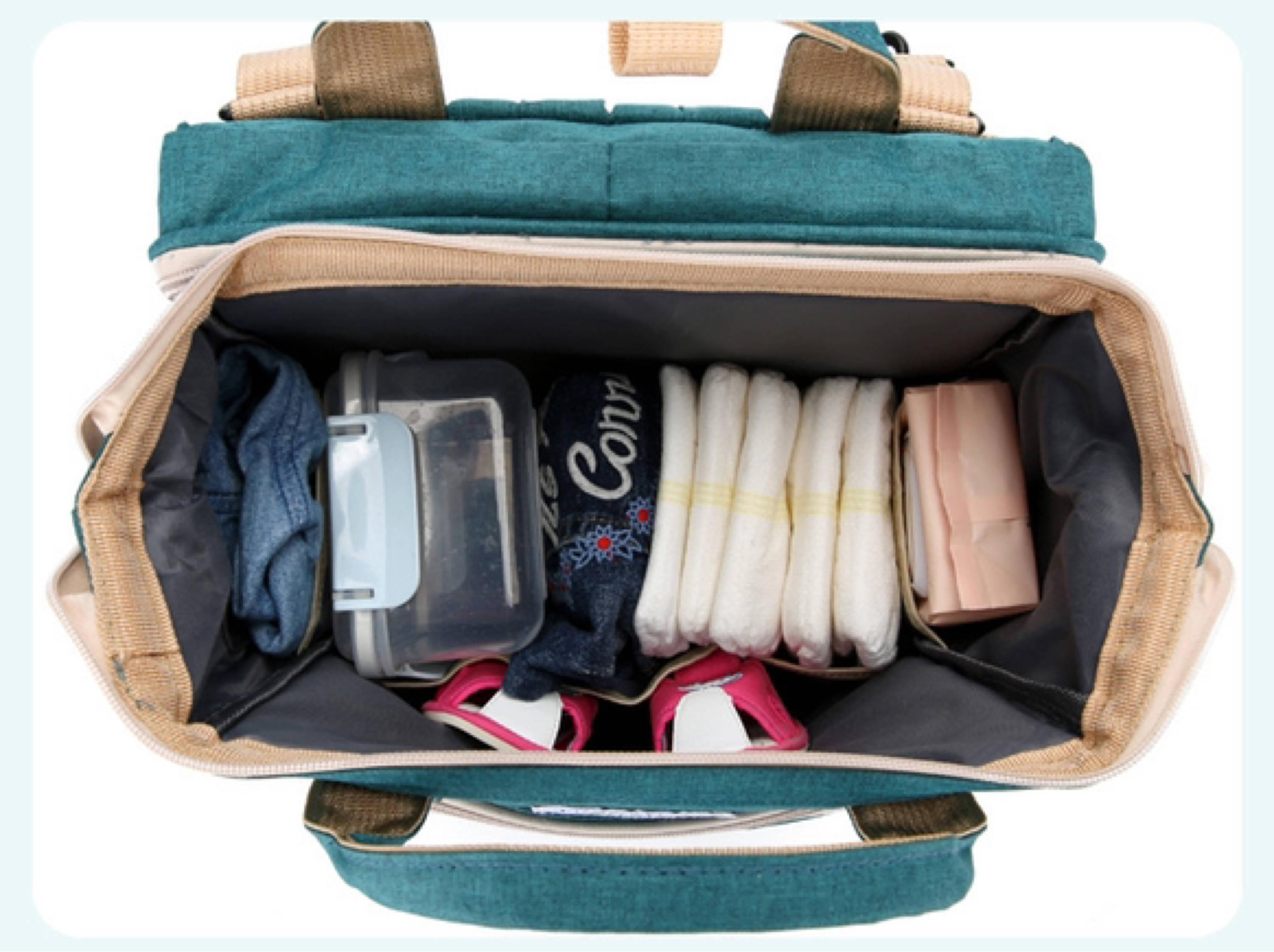 Mom's Bag - Zaino Cambio con Fasciatoio, disponibile in Viola, Pesca e Nero, progettato per il cambio pannolini e viaggi con bambini.