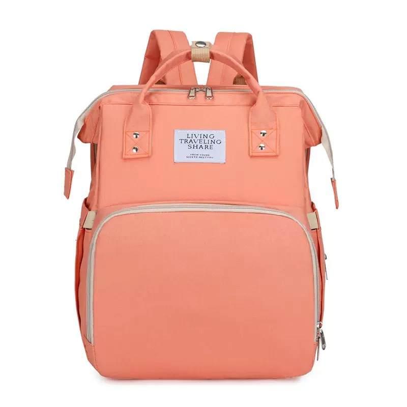 Mom's Bag - Zaino Cambio con Fasciatoio, disponibile in Viola, Pesca e Nero, progettato per il cambio pannolini e viaggi con bambini.