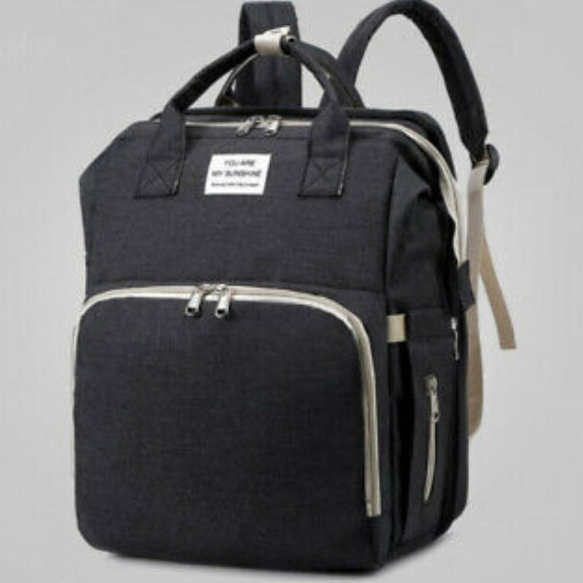 Multi-Use Diaper Bag in gray with expanded toy mode, showcasing its versatility and spacious design for parents on the go.