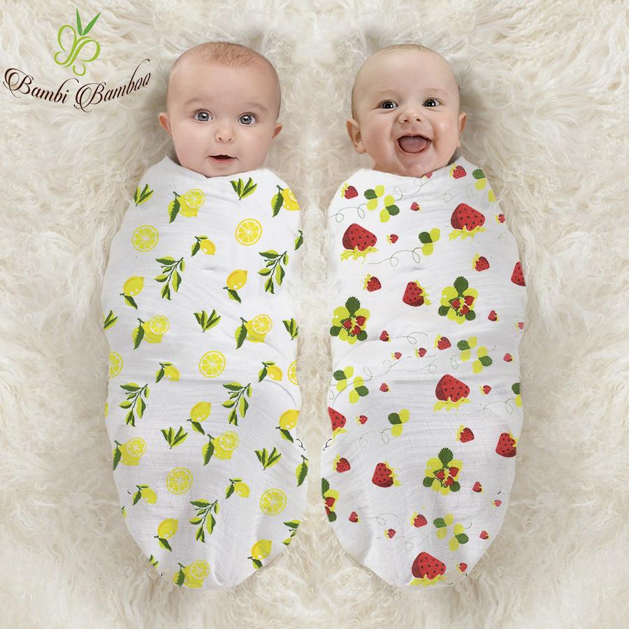 Muslin Swaddle Blanket Set featuring lemon and strawberry prints, showcasing soft and breathable fabric ideal for newborns.