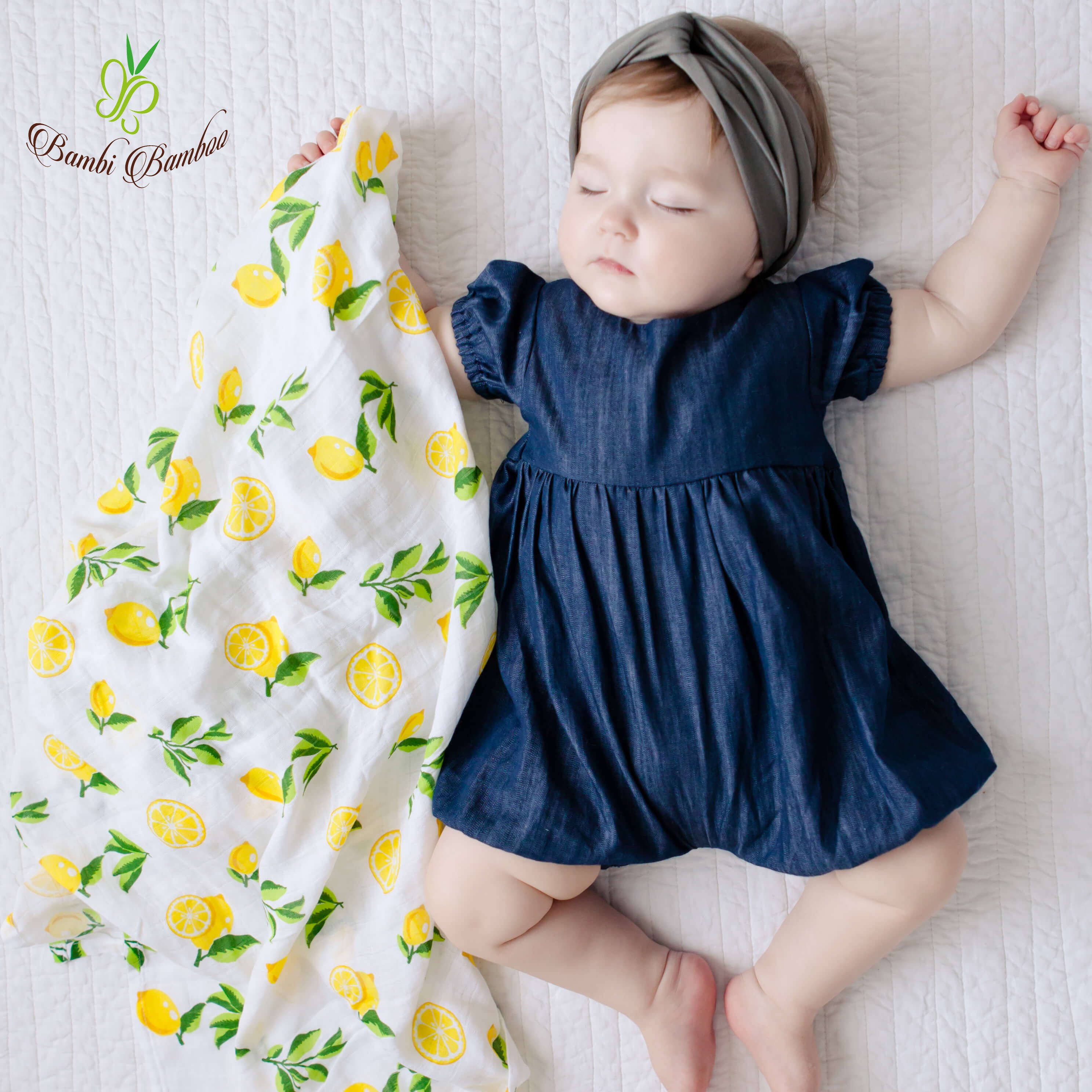 Muslin Swaddle Blanket Set featuring lemon and strawberry prints, showcasing soft and breathable fabric ideal for newborns.