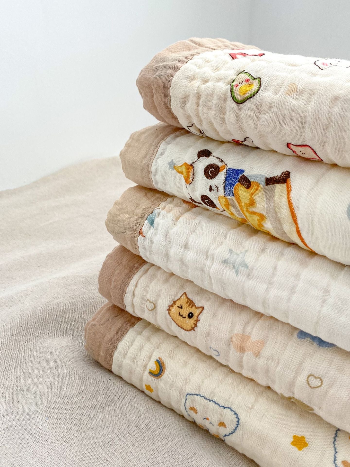 Soft and absorbent cartoon printed clothing for newborns and children in vibrant colors and fun patterns.