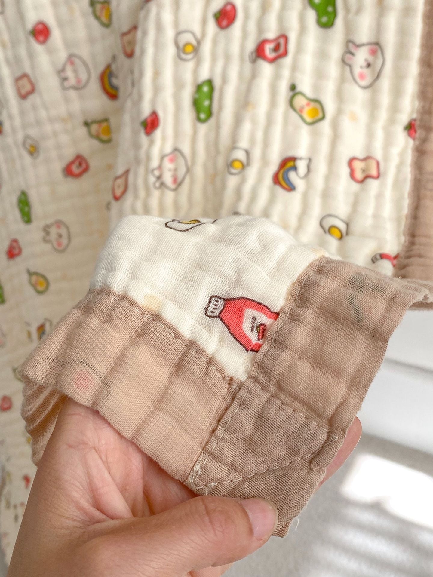 Soft and absorbent cartoon printed clothing for newborns and children in vibrant colors and fun patterns.