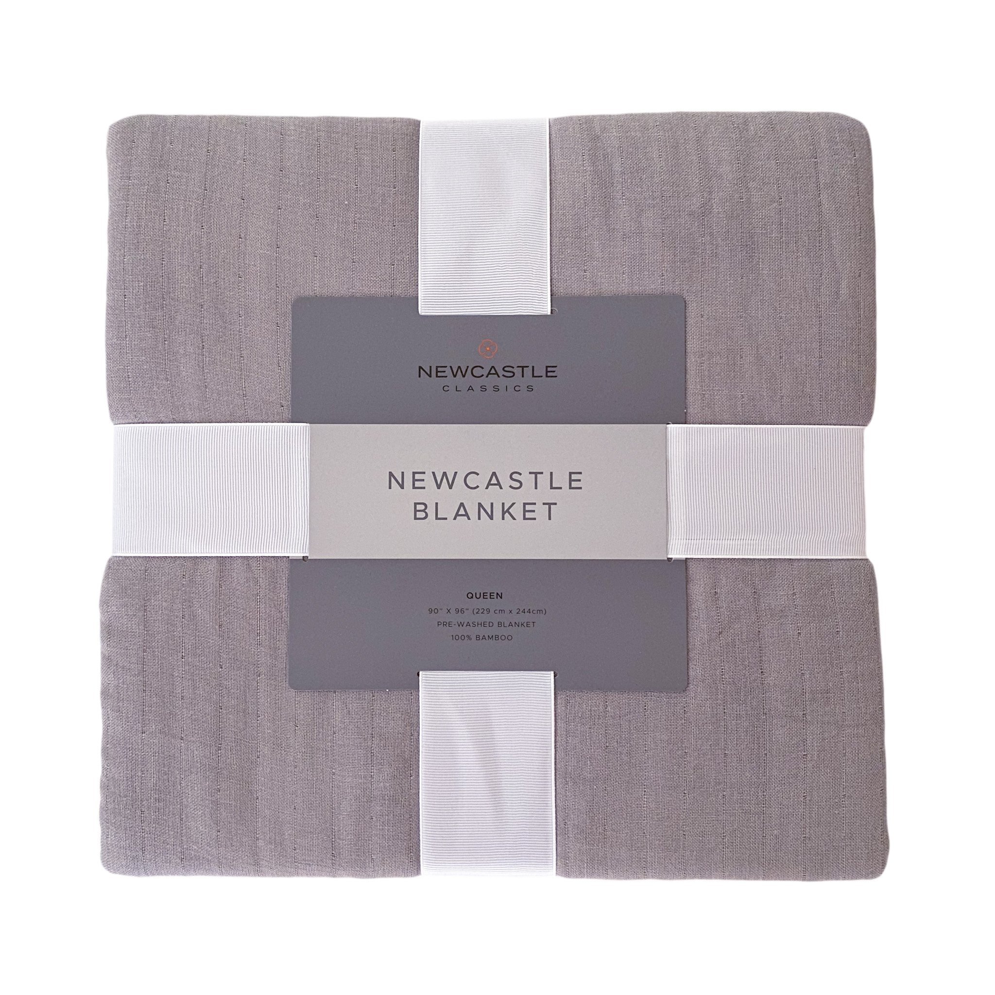 Newcastle Grey Oversized Queen Bamboo Bed Blanket displayed on a bed, showcasing its soft texture and elegant design.