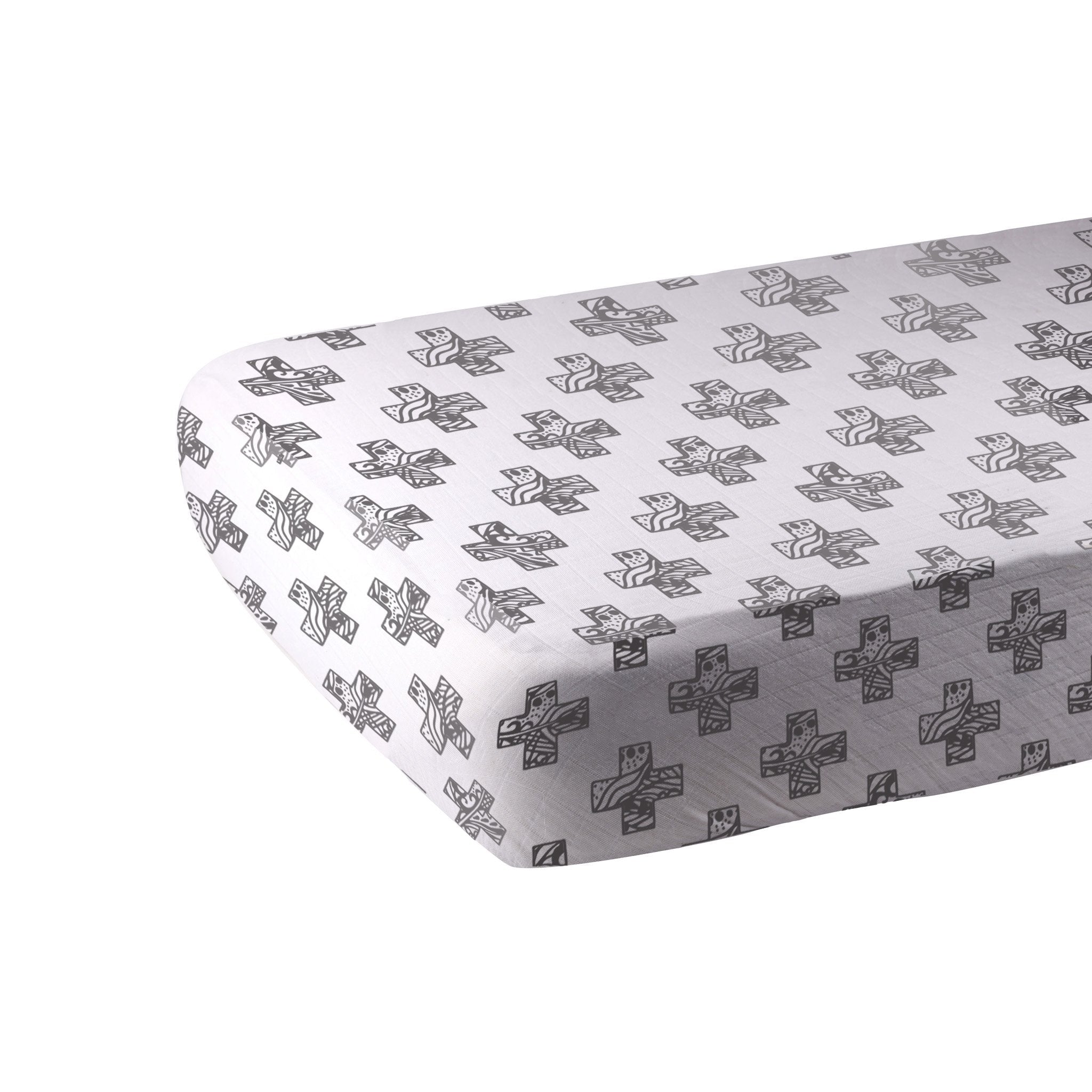 Nordic Stamp Bamboo Muslin Crib Sheet in a crib, showcasing its soft texture and stylish design.