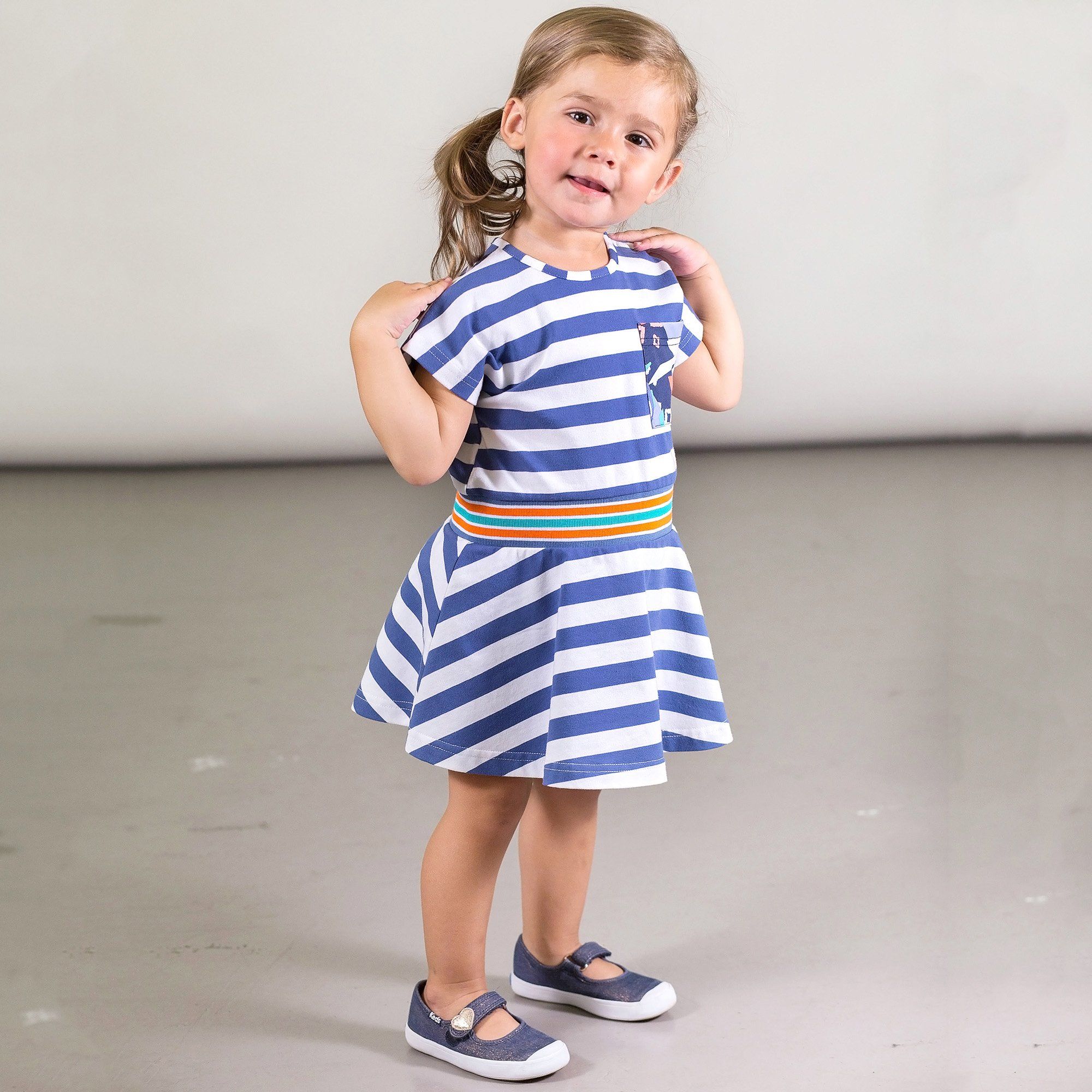 A charming Organic Cotton Striped Dress with Pocket featuring short sleeves, a round neckline, and a flared A-line skirt, perfect for kids.