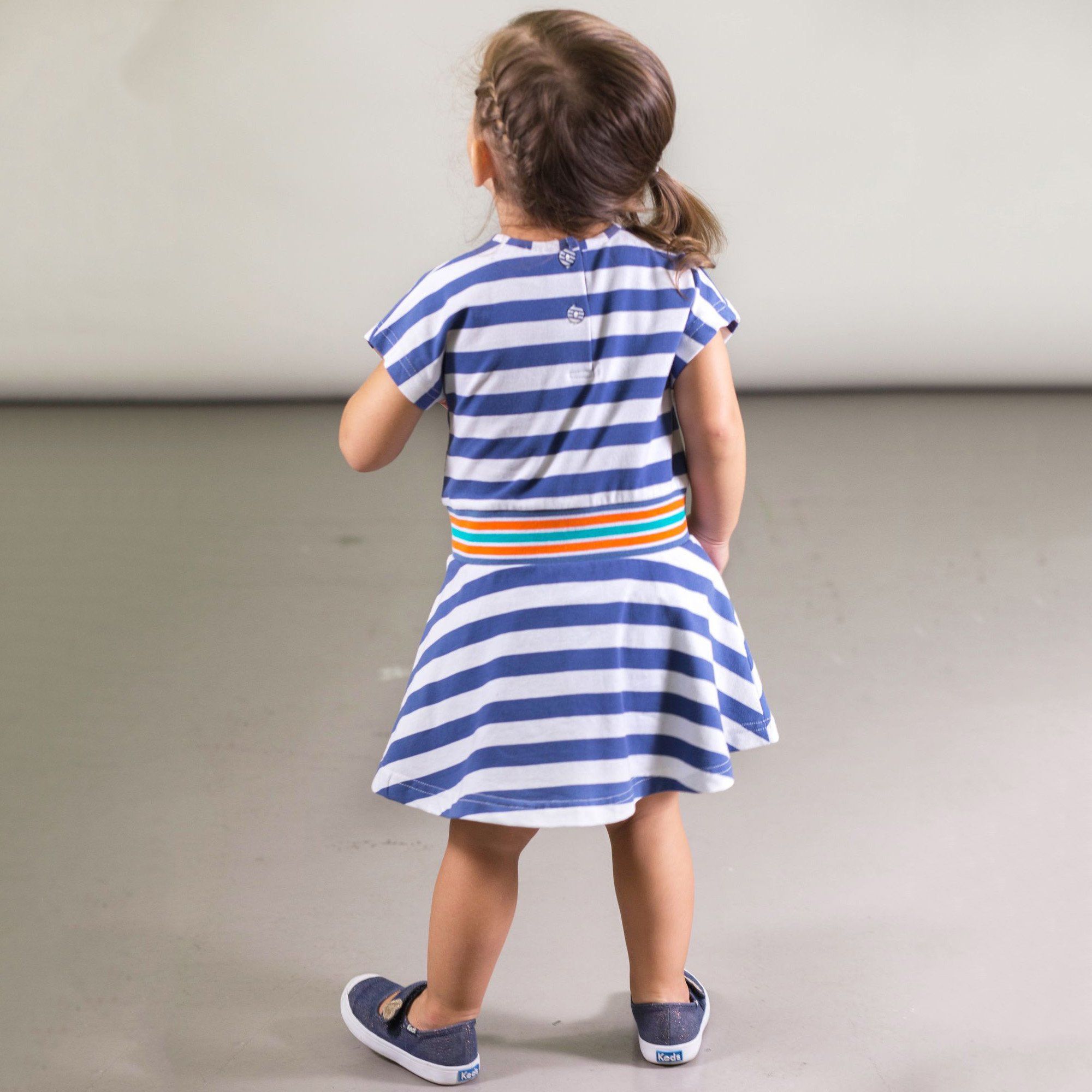 A charming Organic Cotton Striped Dress with Pocket featuring short sleeves, a round neckline, and a flared A-line skirt, perfect for kids.
