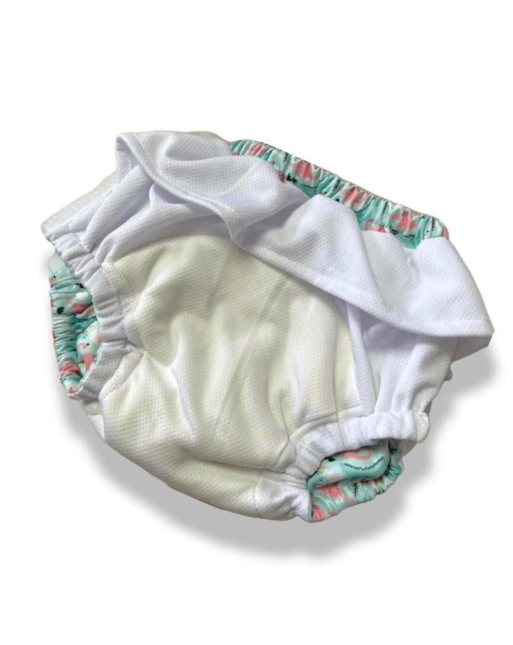 TITTI Pocket-Trainer washable diaper featuring a playful cat design, showcasing its waterproof exterior and adjustable Velcro closure.