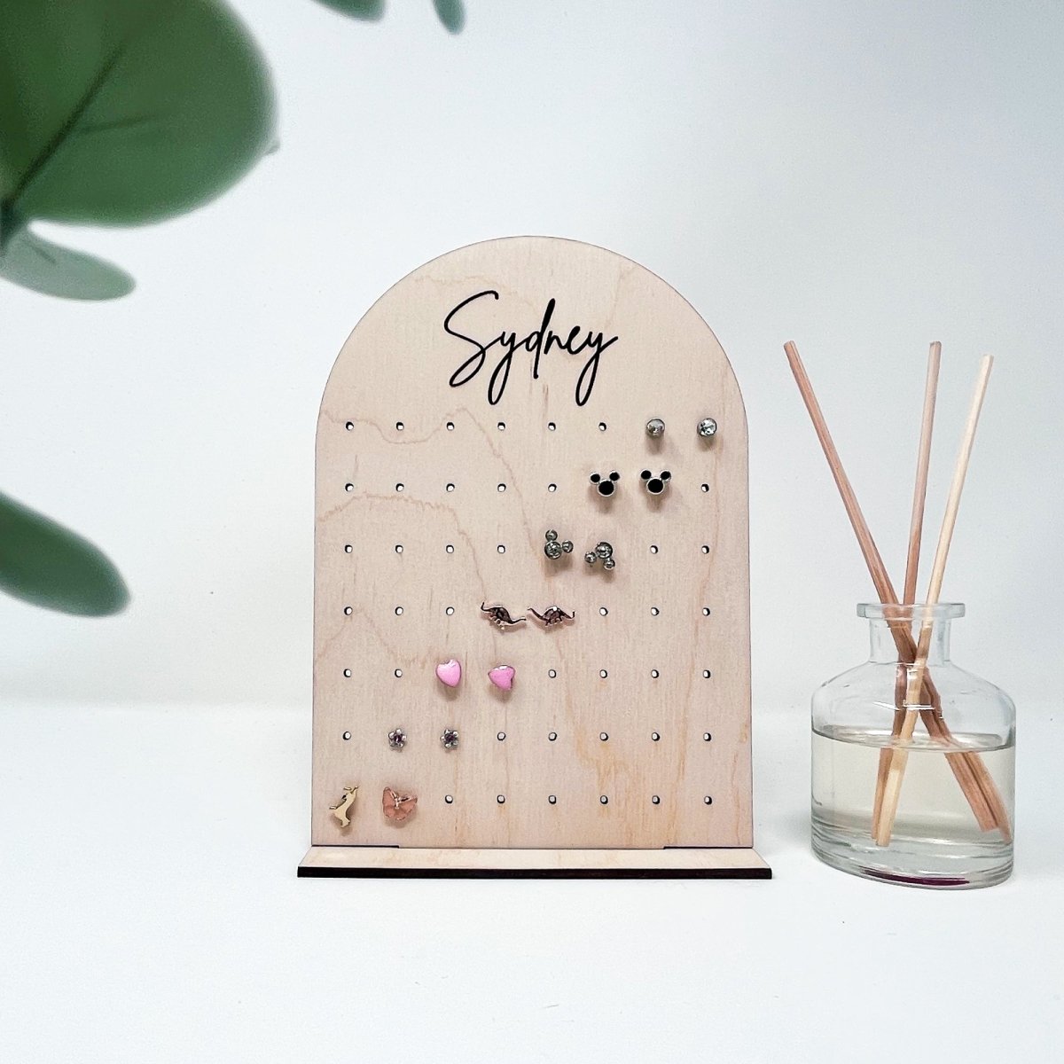 Wooden earring display stand.