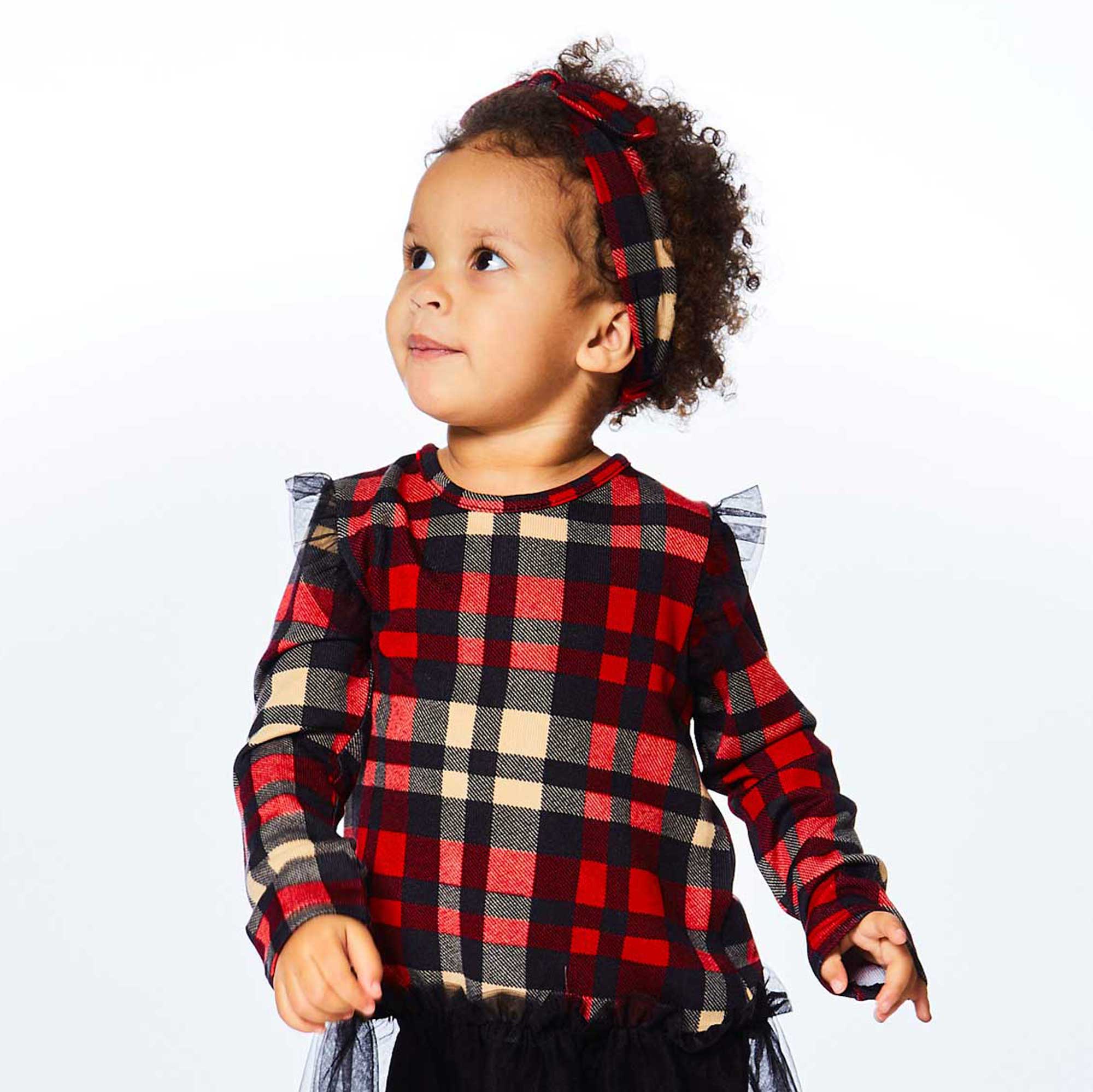 A stylish plaid knotted headband featuring a soft poly/elastane blend with a comfortable stretch fit and a trendy bow design.