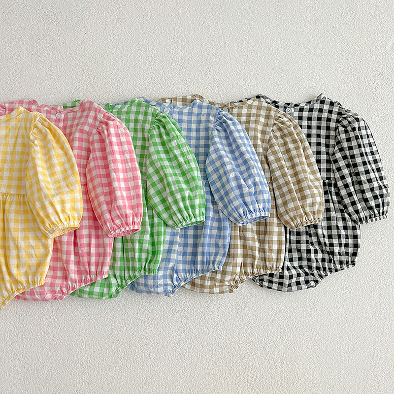 A collection of plaid pattern onesies for baby girls in various colors including black, pink, blue, green, yellow, and brown, made from soft cotton.