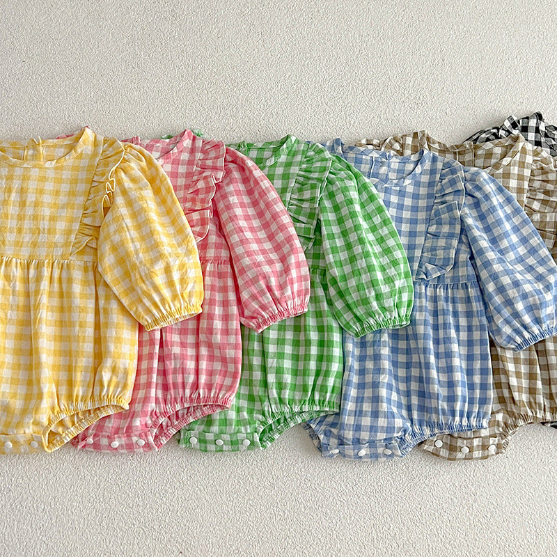 A collection of plaid pattern onesies for baby girls in various colors including black, pink, blue, green, yellow, and brown, made from soft cotton.