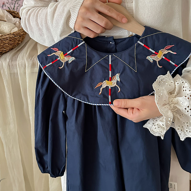 A navy blue long sleeve dress for girls featuring horse embroidery on the collar, made from soft cotton, perfect for autumn wear.