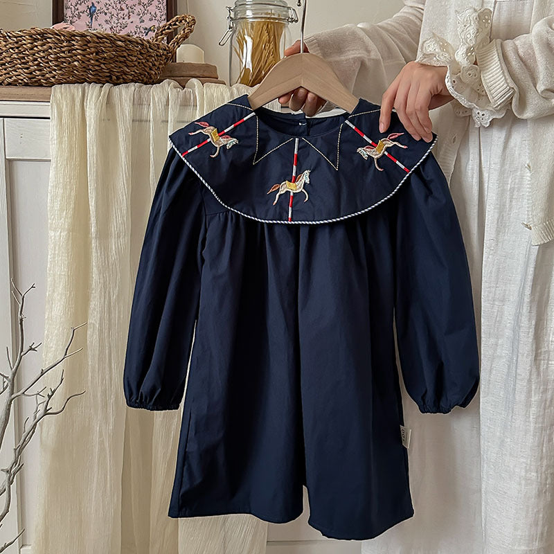 A navy blue long sleeve dress for girls featuring horse embroidery on the collar, made from soft cotton, perfect for autumn wear.