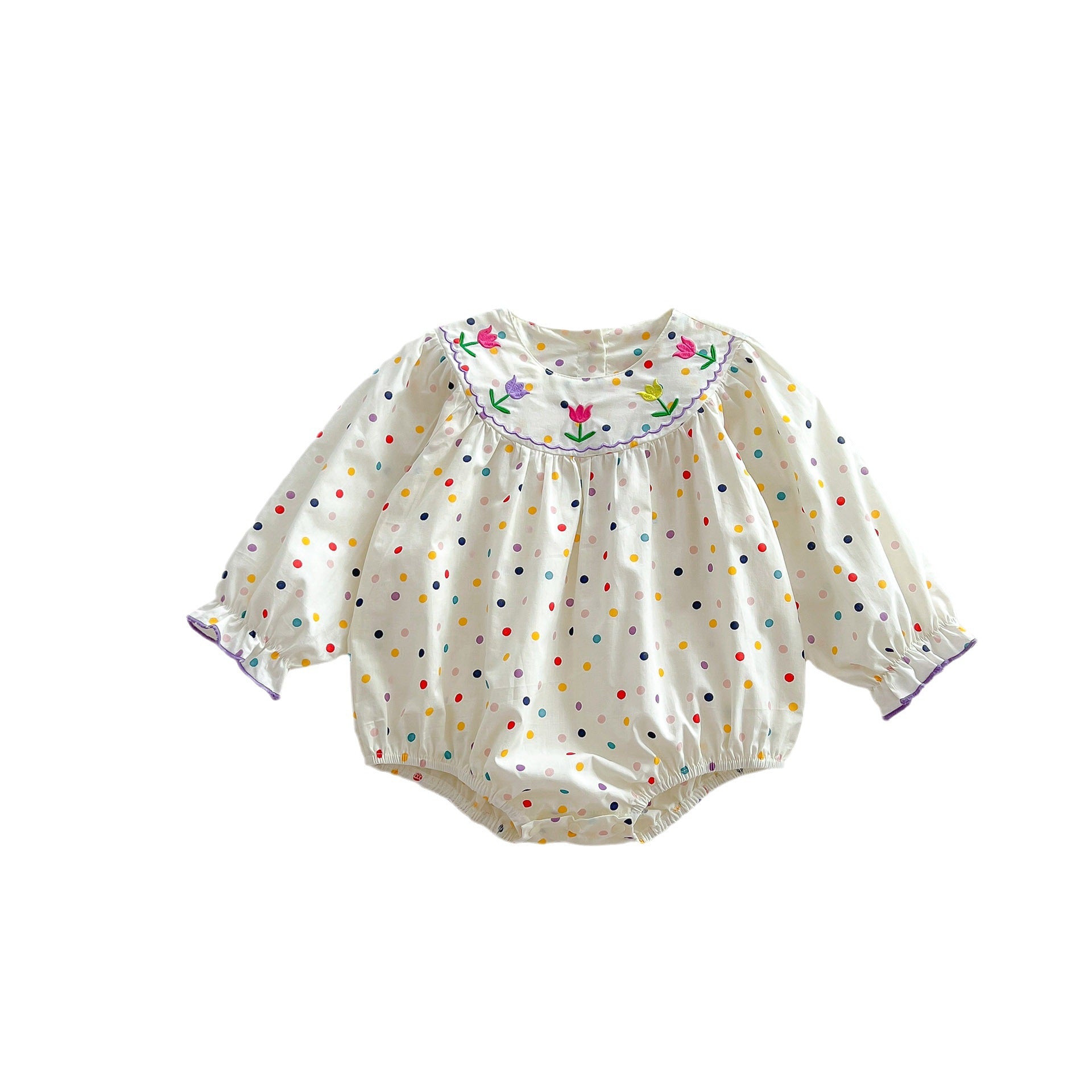A cute baby girl wearing a long sleeve princess onesie with floral and solid patterns in white and pink colors.