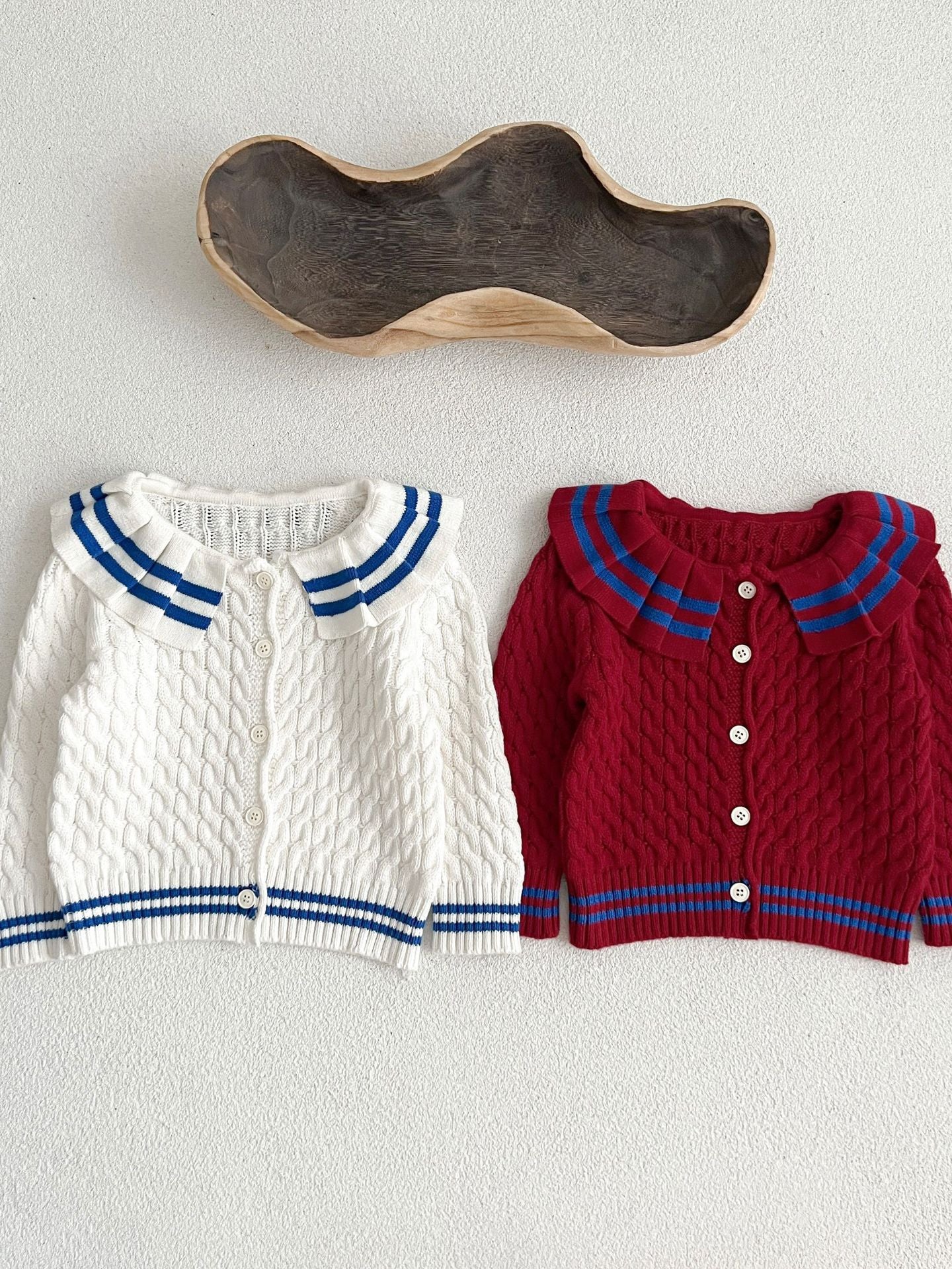 A stylish Sailor Style Striped Pattern Single Breasted Cardigan in white and red, made of soft cotton, suitable for baby girls and boys.