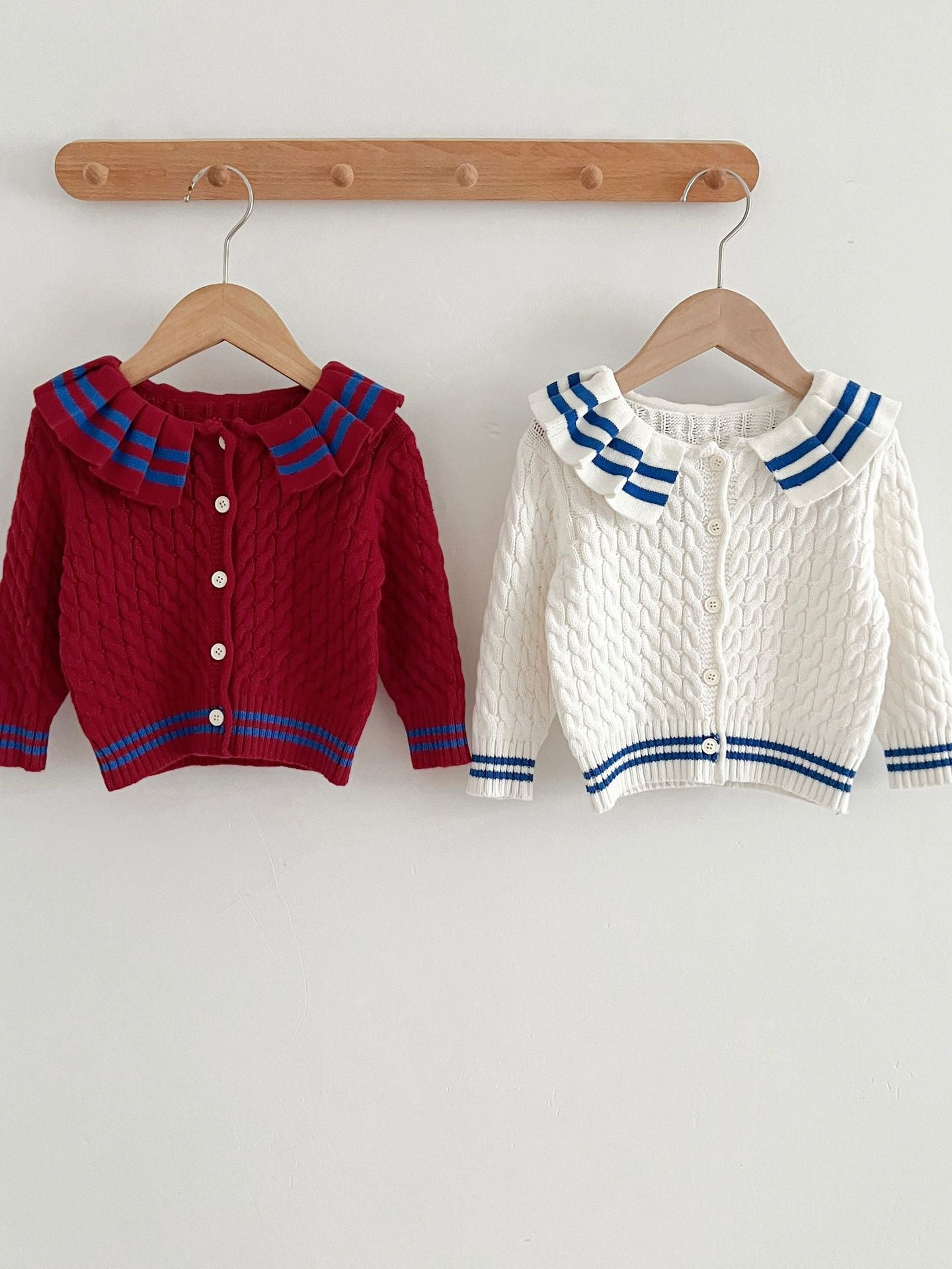 A stylish Sailor Style Striped Pattern Single Breasted Cardigan in white and red, made of soft cotton, suitable for baby girls and boys.