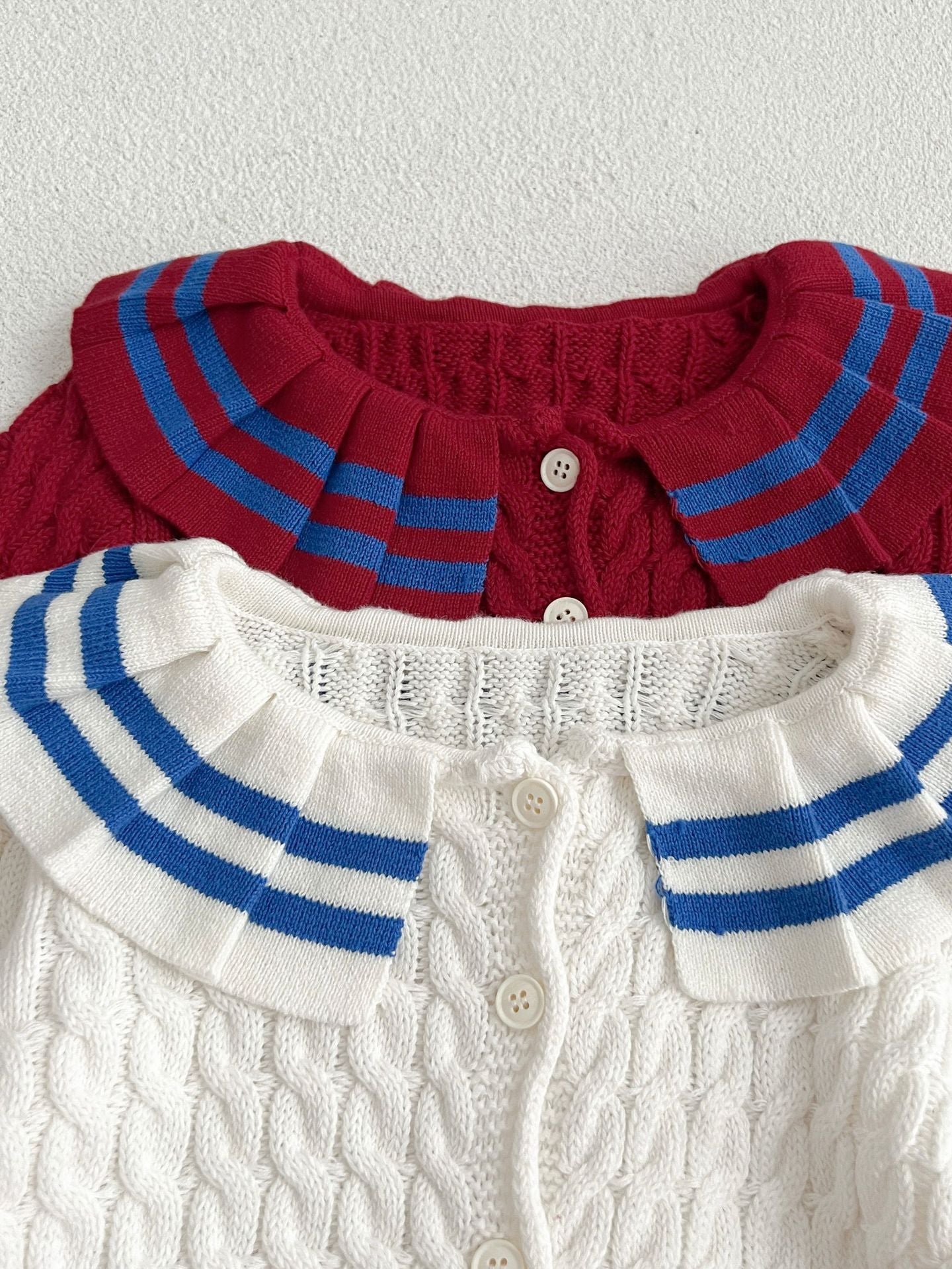 A stylish Sailor Style Striped Pattern Single Breasted Cardigan in white and red, made of soft cotton, suitable for baby girls and boys.