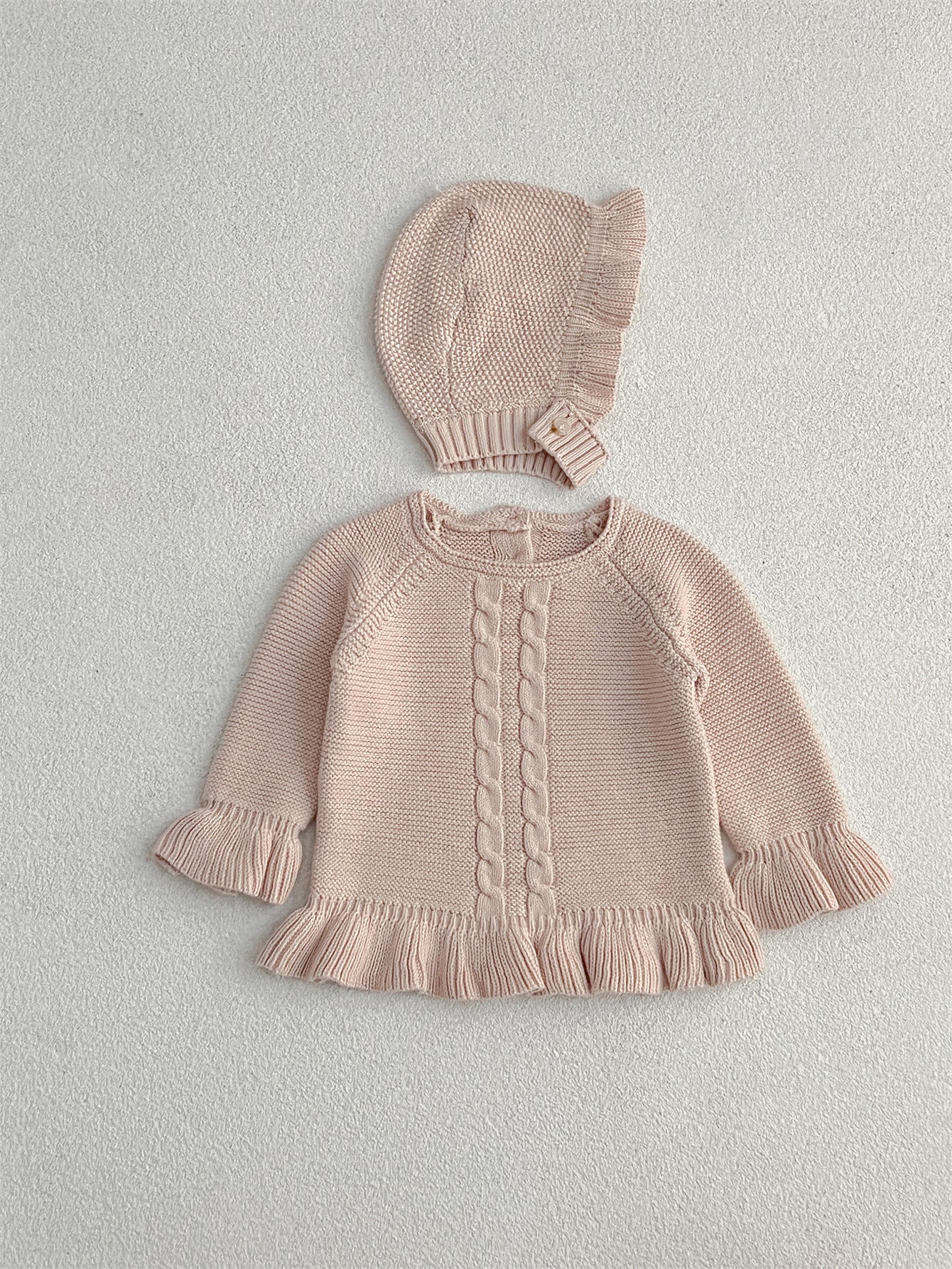 Khaki knitted pullover sweater for infant baby girls with long flared sleeves, made from soft cotton material.
