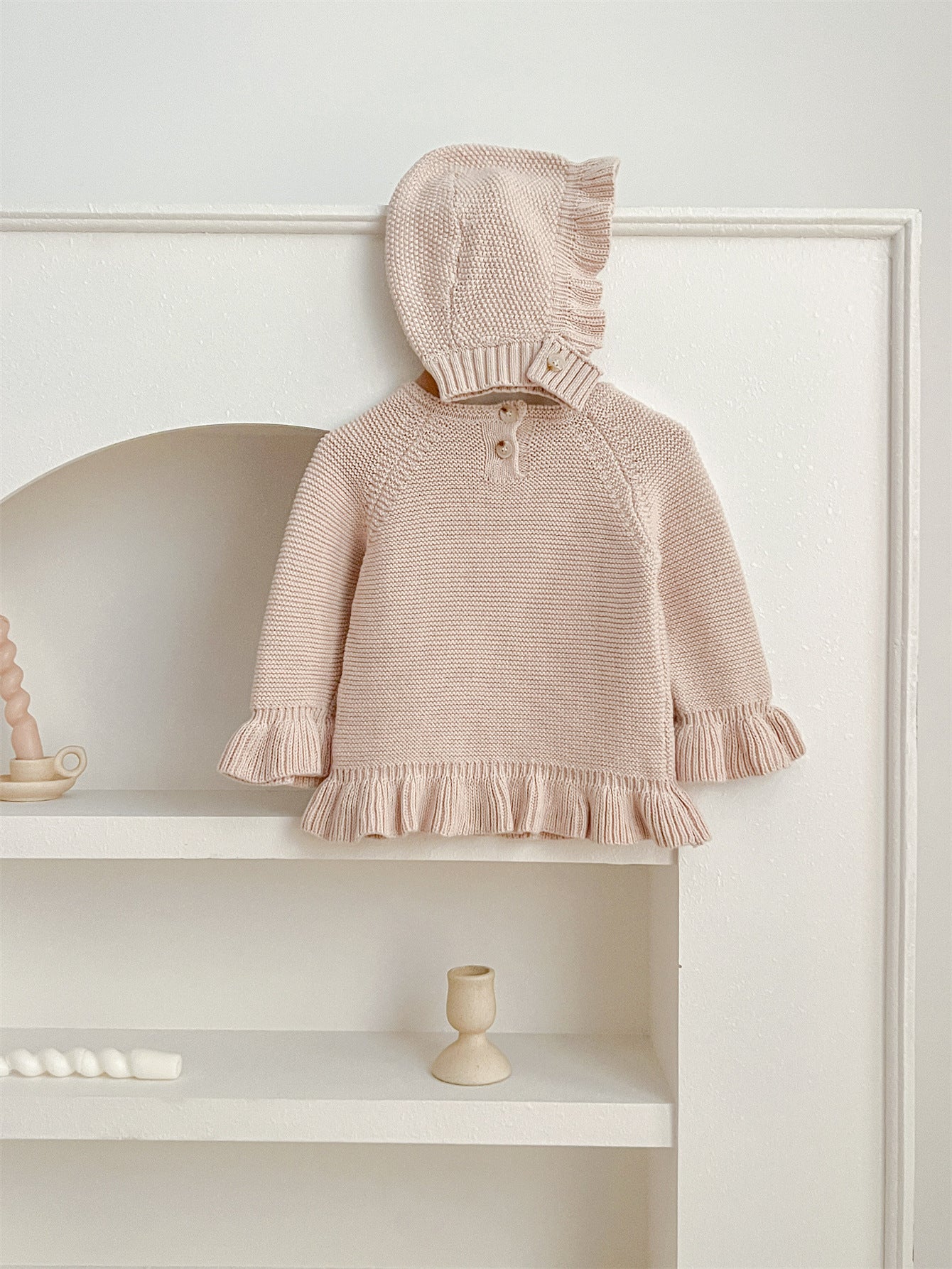 Khaki knitted pullover sweater for infant baby girls with long flared sleeves, made from soft cotton material.