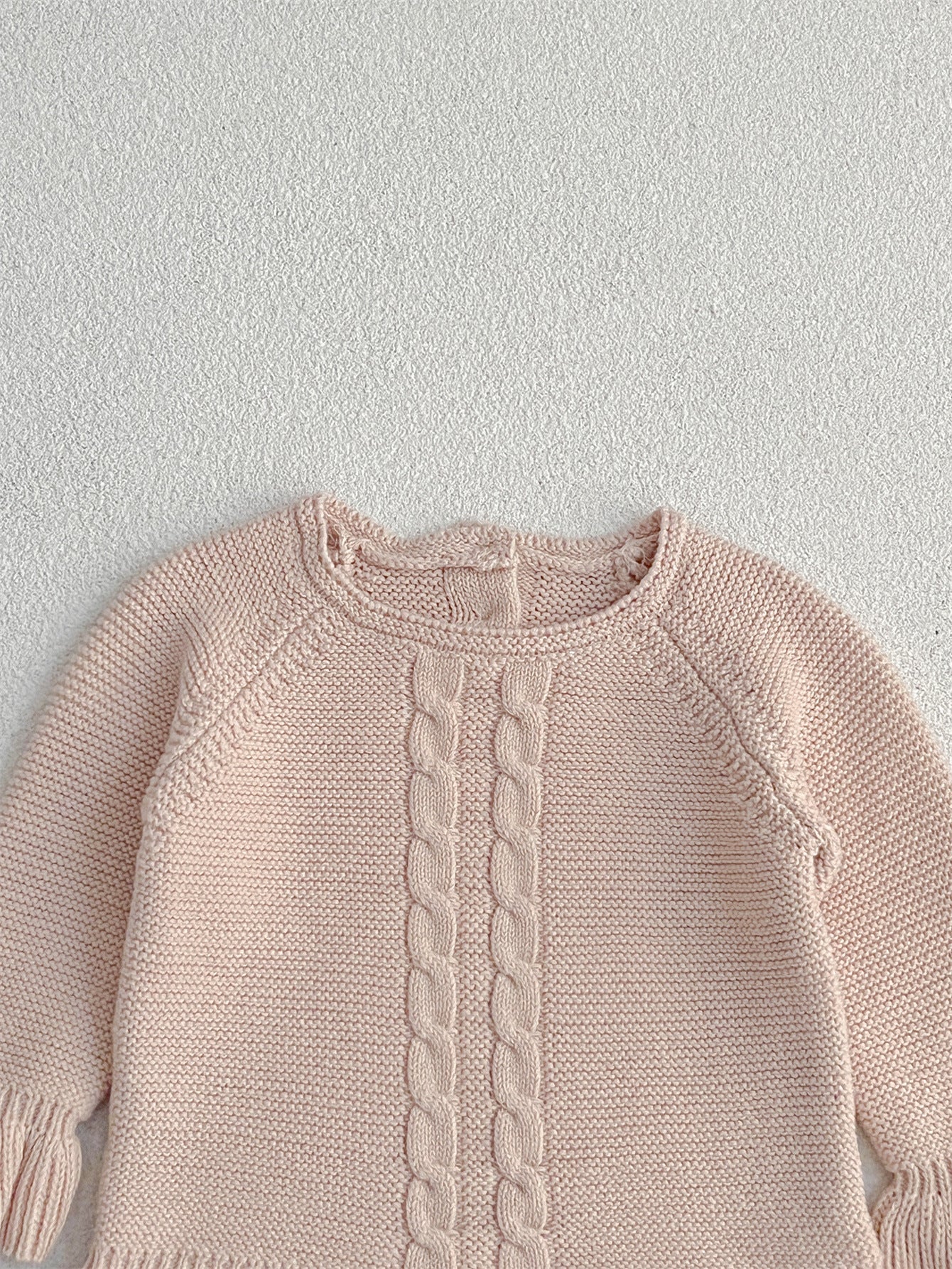 Khaki knitted pullover sweater for infant baby girls with long flared sleeves, made from soft cotton material.