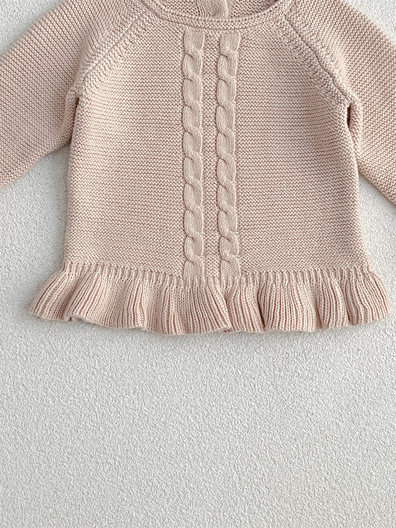 Khaki knitted pullover sweater for infant baby girls with long flared sleeves, made from soft cotton material.