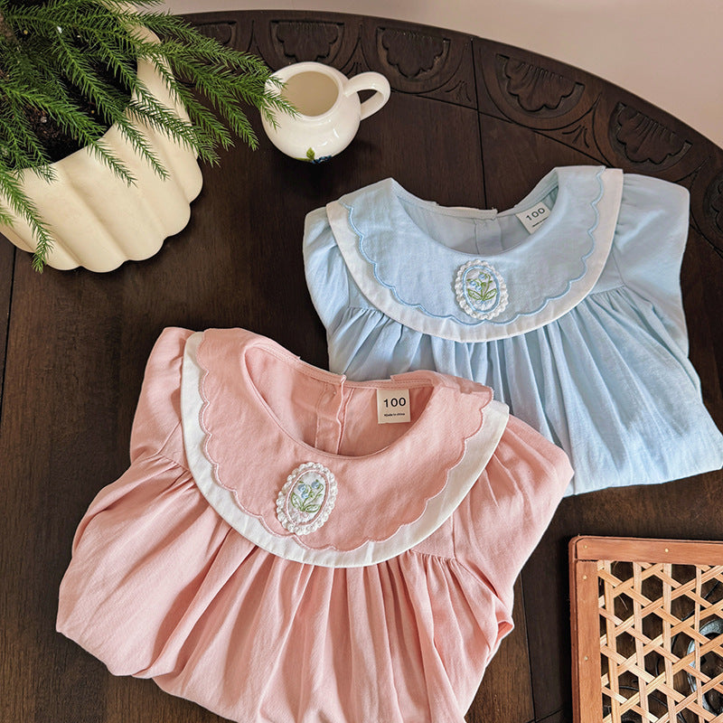 A stylish long-sleeve top for girls featuring a flower embroidered collar, available in pink and blue colors, made from soft cotton fabric.