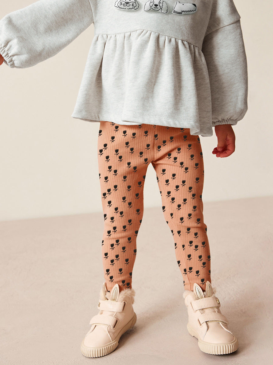 A cute long sleeves top for girls featuring a cartoon dog pattern, made from soft cotton and polyester, perfect for spring and autumn.