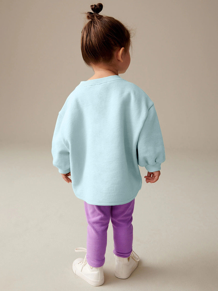 A cute blue long sleeves top for girls featuring a cartoon rabbit pattern, perfect for spring and autumn wear.