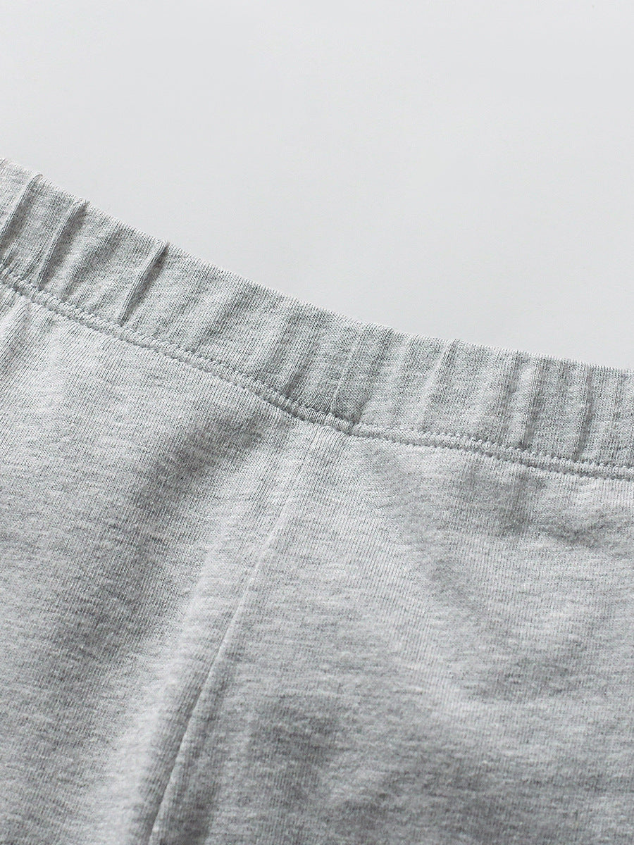 A pink long sleeves top featuring a cute cartoon unicorn pattern, designed for girls aged 12 months to 10 years.