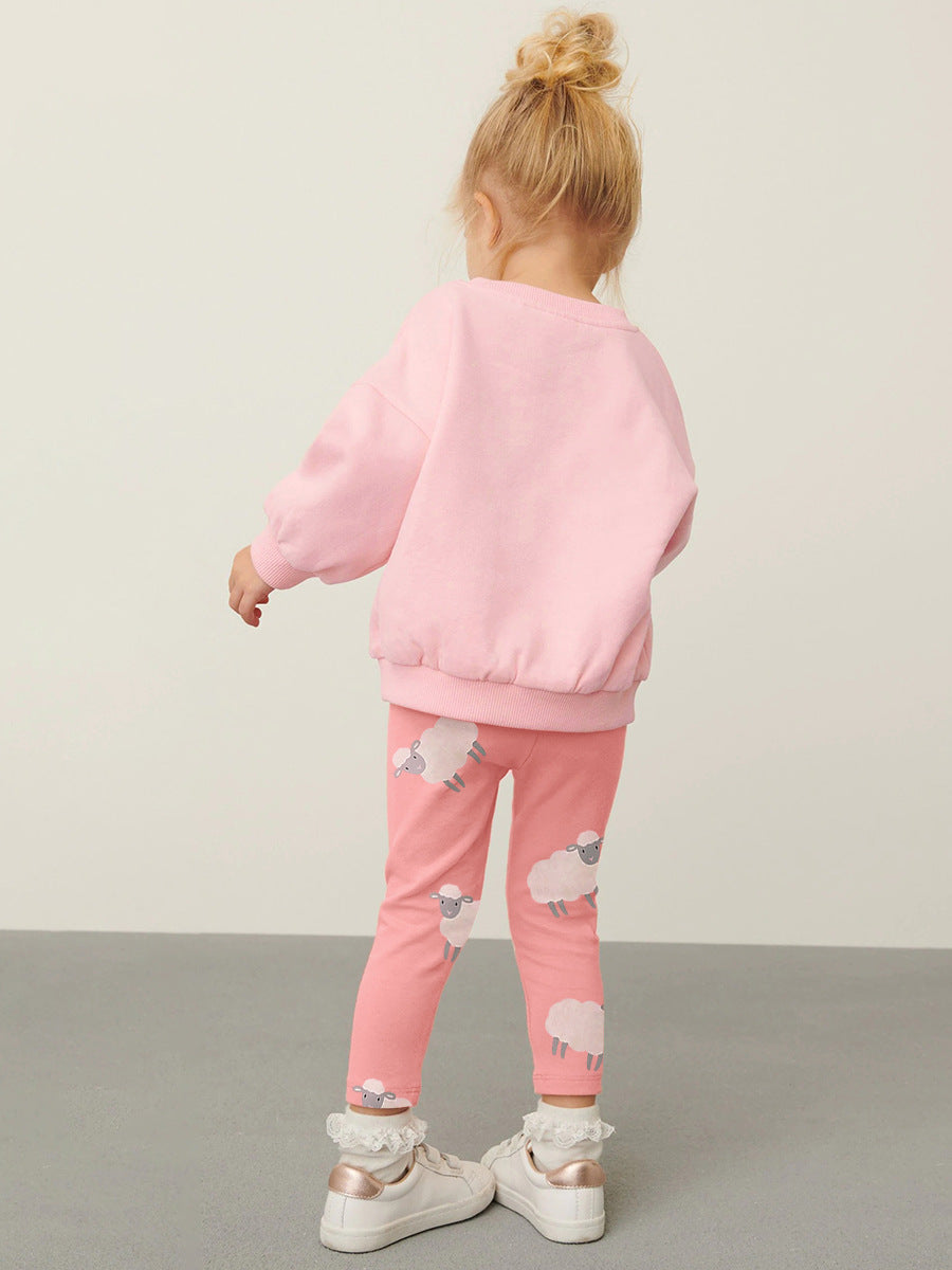 A pink long sleeves top for girls featuring a cute sheep cartoon pattern, made from cotton and polyester, perfect for spring and autumn.