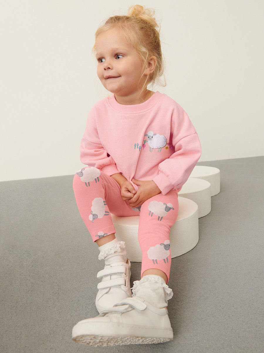 A pink long sleeves top for girls featuring a cute sheep cartoon pattern, made from cotton and polyester, perfect for spring and autumn.