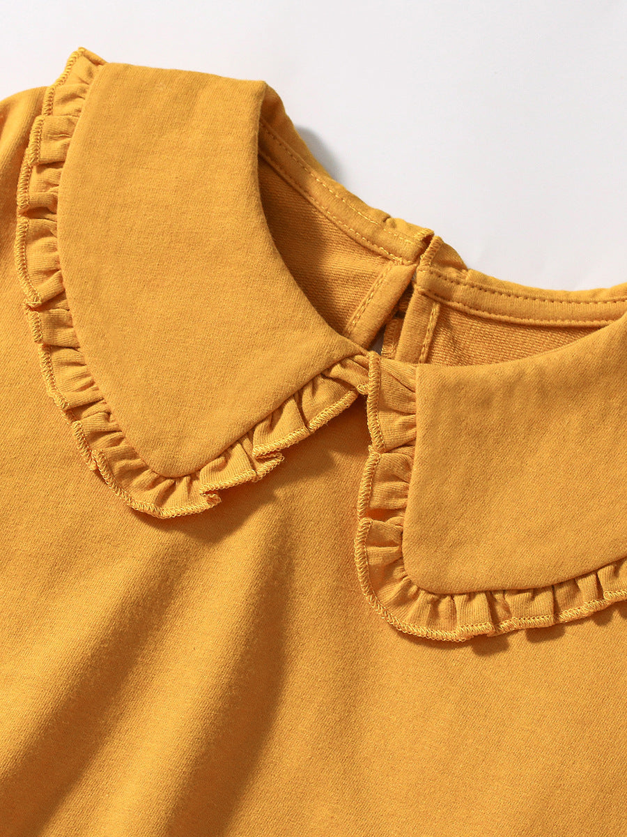 A vibrant yellow long-sleeve top for girls featuring a preppy collar, made from cotton and polyester, perfect for spring and autumn wear.