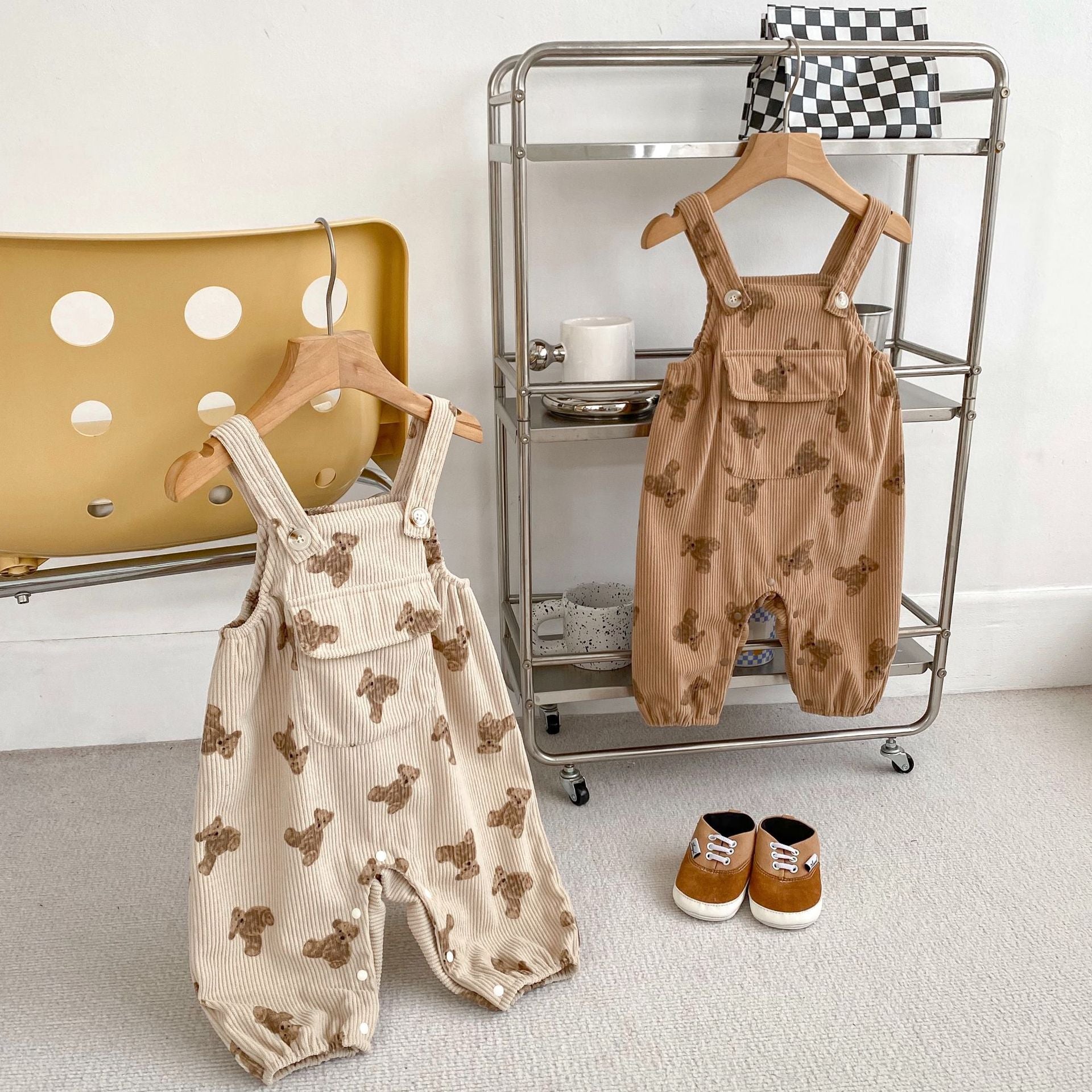 Adorable unisex baby corduroy overalls in khaki and brown with a cute teddy cartoon pattern, perfect for spring and autumn.