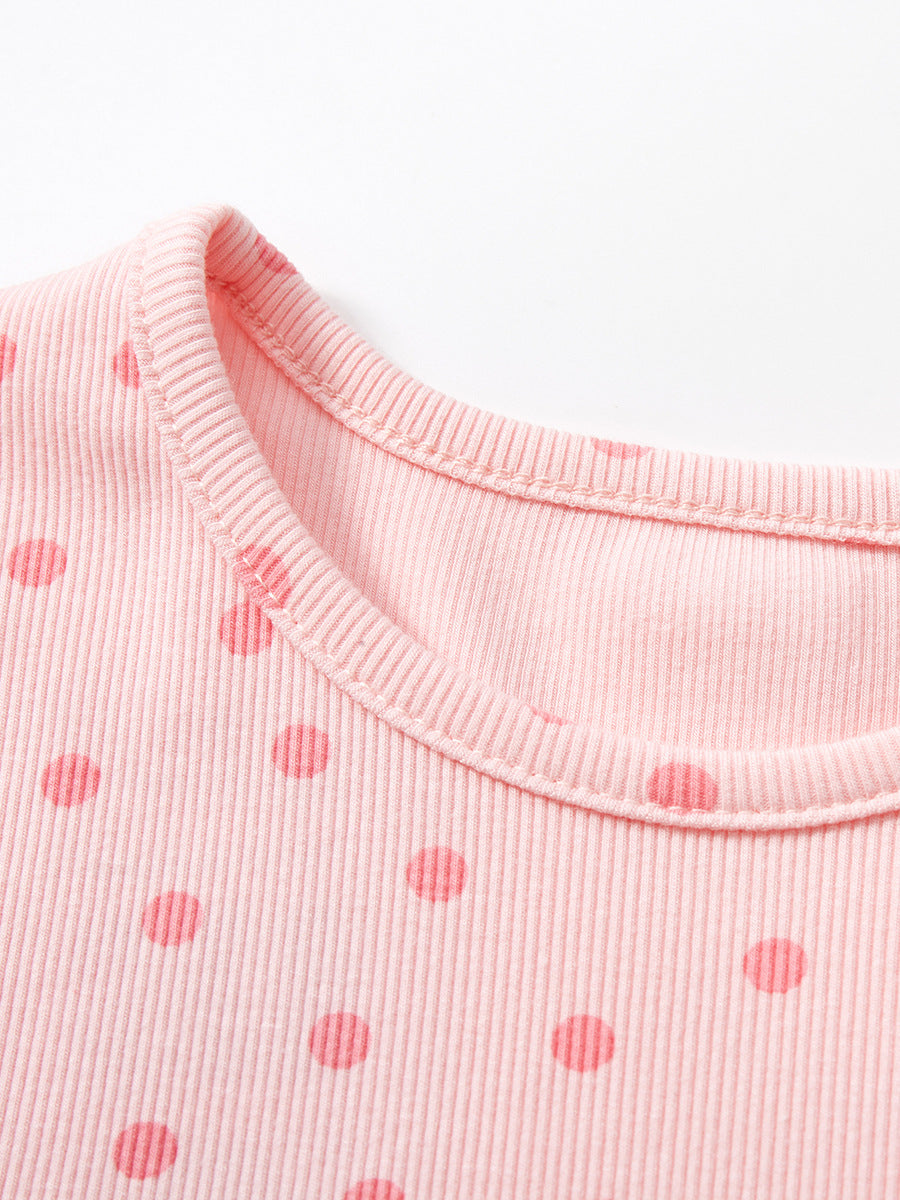 Light pink baby girl dress with polka dots and short sleeves, perfect for spring and summer occasions.