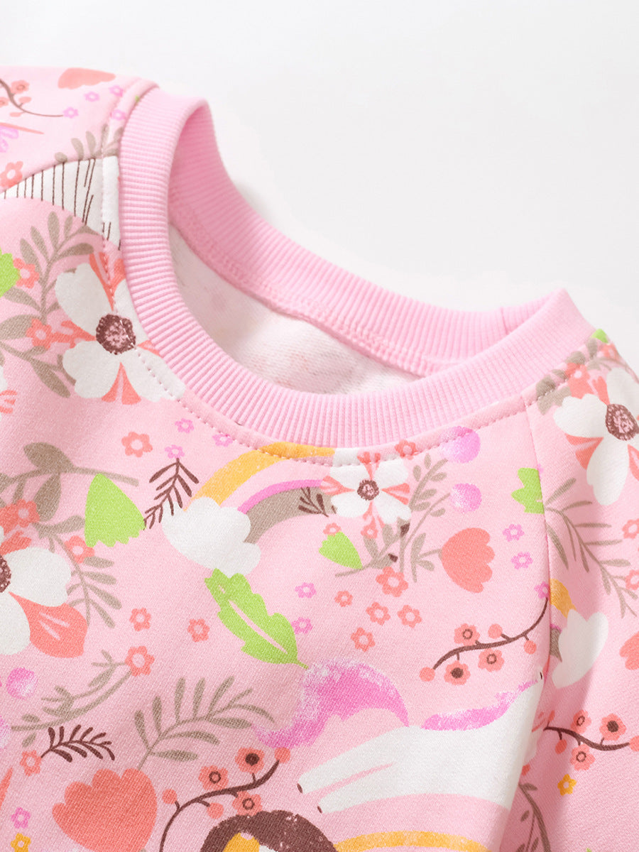 A vibrant pink short-sleeved top for baby girls featuring rainbow animal prints and floral designs, perfect for spring and summer wear.